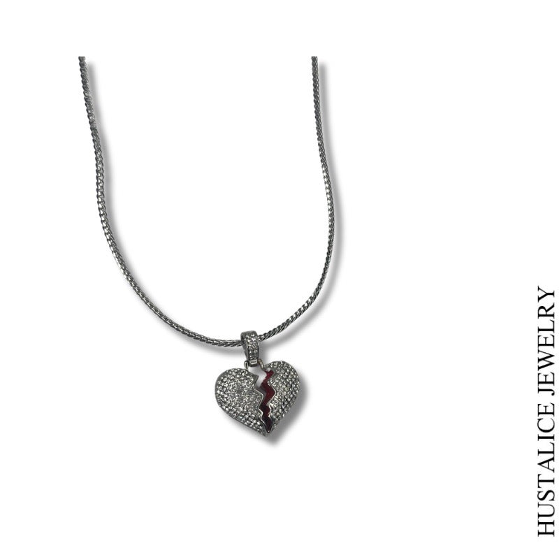 This beautiful necklace measures 18" long. It is complemented by a delicate heart overflowing with sparkling stones.