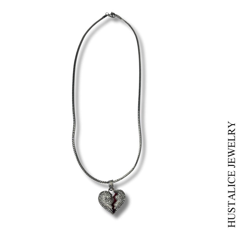 This beautiful necklace measures 18" long. It is complemented by a delicate heart overflowing with sparkling stones.